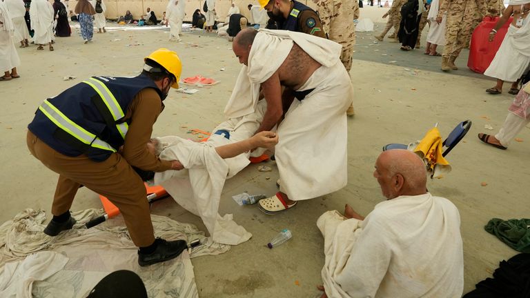 Paramedics carry a muslim pilgrim for a medical check  due to a heat stroke in Mina, near the holy city of Mecca, Saudi Arabia.
Pic: Reuters