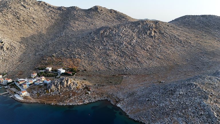 Pic: Yui Mok/PA
A view of Pedi, a smalll fishing village in Symi, Greece, where a search and rescue operation is under way for TV doctor and columnist Michael Mosley, after he went missing while on holiday. Police and firefighters have been using drones to scour the island, which is part of the Dodecanese island chain and is about 25 miles north of Rhodes. Picture date: Saturday June 8, 2024.
