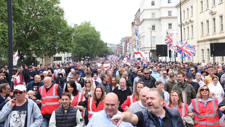People take part in a protest march through London, organised by Tommy Robinson, whose real name is Stephen Yaxley Lennon. Groups from across the UK linked to football disorder are expected to attend the event the Metropolitan Police said. Picture date: Saturday June 1, 2024