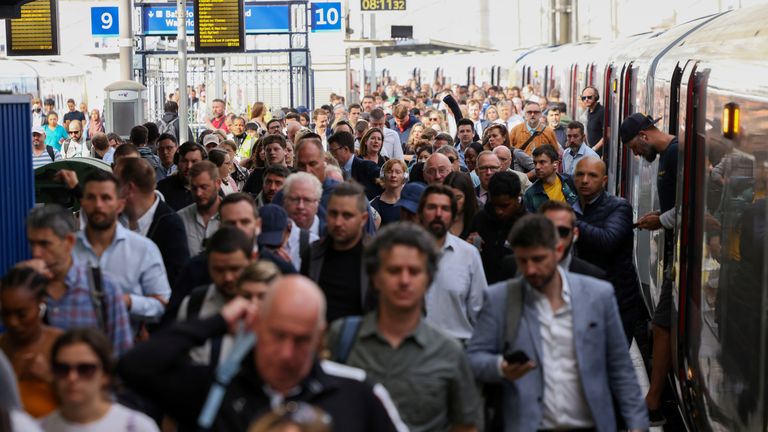 Passengers walk after getting off a train at the Waterloo Station, on the first day of national rail strike in London, Britain, June 21, 2022. REUTERS/Henry Nicholls