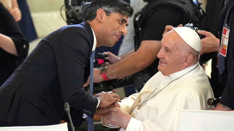 Rishi Sunak greets Pope Francis ahead of a working session at the G7
Pic:AP