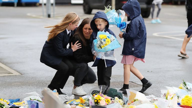 Rob Burrow's wife Lindsey and their children Jackson, Maya and Macy lay flowers at Headingley Stadium. Pic: Ben Lack Photography Ltd