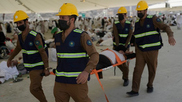 Paramedics carry a muslim pilgrim for a medical check due to a heat stroke at pillars, in Mina, near the holy city of Mecca, Saudi Arabia .
Pic:AP