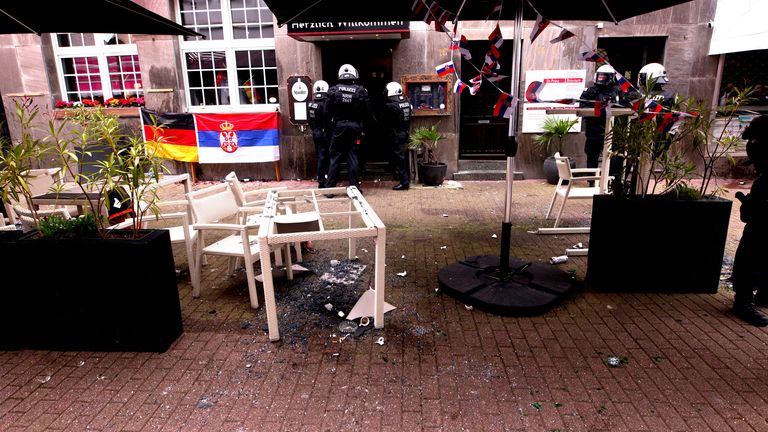 Police officers secure the area after clashes between fans ahead of the match.
Pic: Reuters