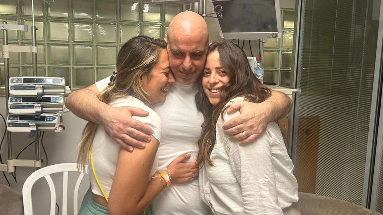Shlomi Ziv, a rescued hostage embraces his sister, Revital Nasi, and his cousin, Liat Ariel, who struggled for more than 8 months to bring him home, and after the military said that Israeli forces have rescued four hostages alive from the central Gaza Strip, in Ramat Gan, Israel, in this handout image obtained by Reuters on June 8, 2024. The Families Forum/Handout via Reuters THIS IMAGE HAS BEEN SUPPLIED BY A THIRD PARTY