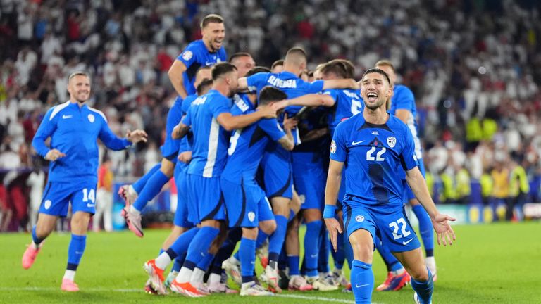 Slovenia's Adam Gnezda Cerin celebrates reaching the round of 16 after a tepid draw against England. Pic: PA