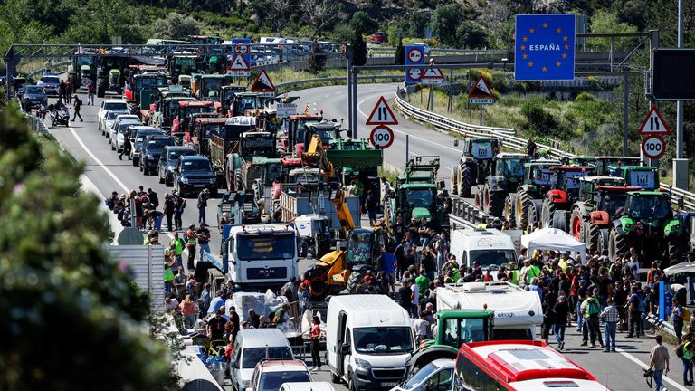 Farmers with tractors block the highway AP-7, near the border between Spain and France, as they demand better conditions ahead European elections, in Le Perthus, Spain, June 3, 2024. REUTERS/Albert Gea
