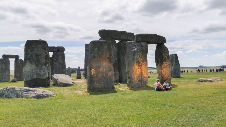 Just Stop Oil protesters spraying an orange substance on Stonehenge.
Pic:Just Stop Oil