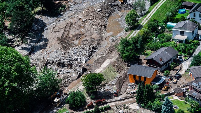 Aerial view of the area affected by the landslide with the houses in the hamlet of Sorte engulfed by stones in Lostallo, Southern Switzerland, after a landslide, caused by the bad weather and heavy rain in the Misox valley, Saturday, June 22 2024. Massive thunderstorms and rainfall led to a flooding situation on Friday evening after a landslide in the Misox valley. Four people went missing on Saturday morning. Several dozen people had to be evacuated from their homes in the Misox and Calanca regions. (Samuel Golay/Keystone via AP)