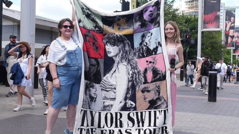 Fans hold a knitted mural of Taylor Swift outside Wembley Stadium in London, ahead of Taylor Swift's first London concert, during her Eras Tour. Picture date: Friday June 21, 2024.Lucy North/PA Wire