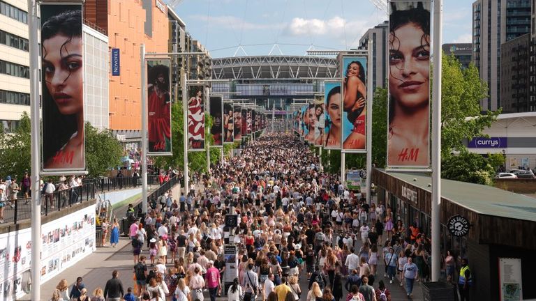 Fans wait outside Wembley Stadium in London, ahead of Taylor Swift's first London concert, during her Eras Tour. Picture date: Friday June 21, 2024. Lucy North/PA Wire