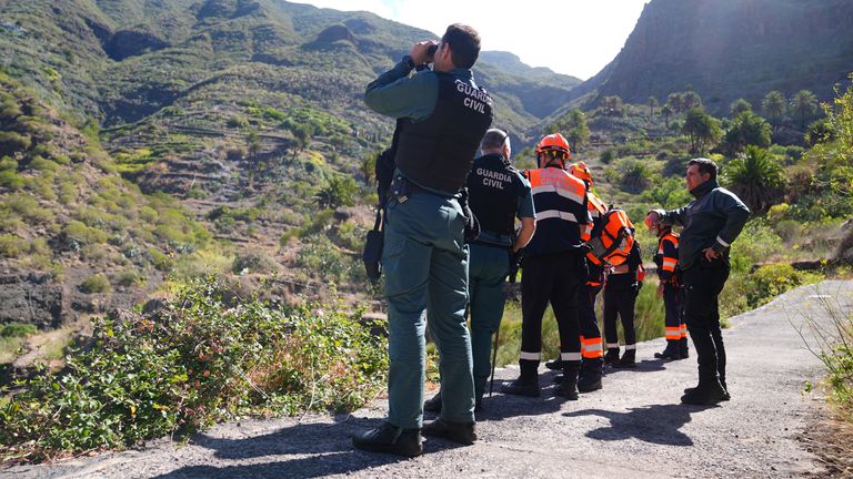 Emergency workers near the village of Masca, Tenerife.
Pic: PA