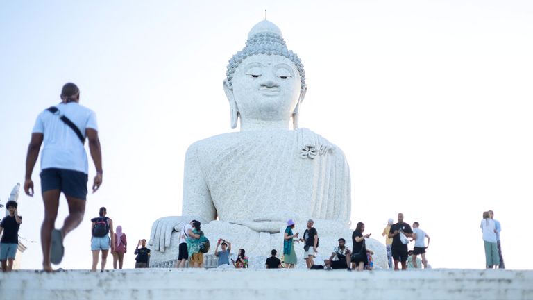 Tourists visit the Big Buddha statue in Phuket, Thailand July 3, 2023. REUTERS/Jorge SIlva