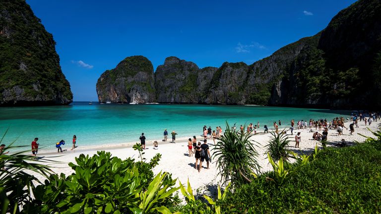Tourists visit Maya bay after Thailand reopened its world-famous beach after closing it for more than three years to allow its ecosystem to recover from the impact of overtourism, at Krabi province, Thailand, January 3, 2022. Picture taken January 3, 2022. REUTERS/Athit Perawongmetha