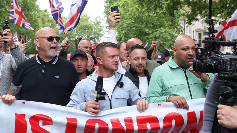 Tommy Robinson (centre), whose real name is Stephen Yaxley Lennon, leads a protest march through London to Parliament Square where speeches will take place and a film will be shown. Groups from across the UK linked to football disorder are expected to attend the event the Metropolitan Police said. Picture date: Saturday June 1, 2024.