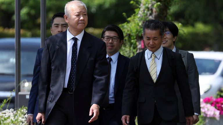 Ministry of Transport officials enter Toyota Motor headquarters on Tuesday.  Photo: AP