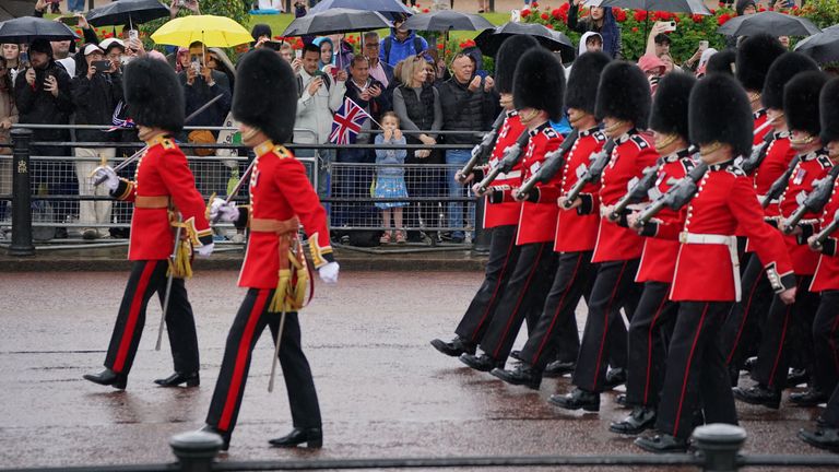 Rain starts on The Mall. Pic: PA