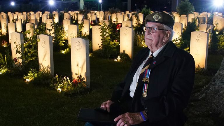 D-Day veteran Sergeant Richard Brock sits next to some of the 4,600 lit headstones during the Commonwealth War Graves Commission&#39;s Great Vigil to mark the 80th anniversary of D-Day at the Bayeux War Cemetery in Normandy, France. 4,600 graves of Second World War service personnel will be illuminated at the cemetery before UK and international personnel hold a vigil at the Stone of Remembrance as the names of the fallen are read out. Picture date: Wednesday June 5, 2024.