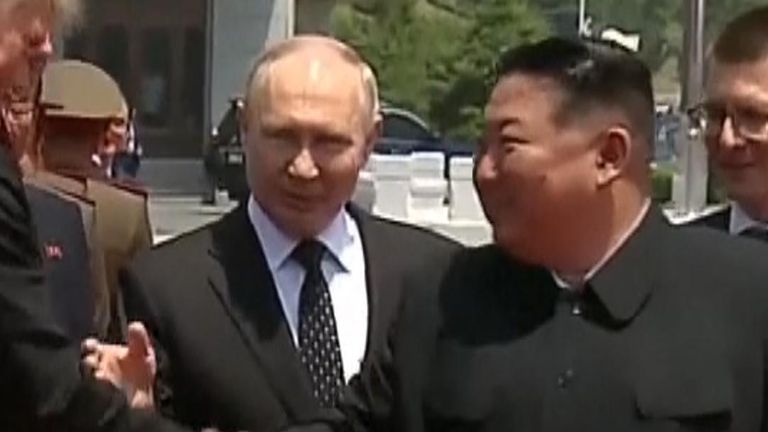 Vladimir Putin introduces Kim Jong Un to his entourage
