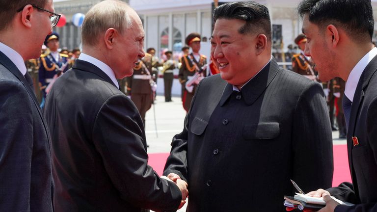 Russian President Vladimir Putin, second left, and North Korea's leader Kim Jong Un, second right, shake hands during the official welcome ceremony in the Kim Il Sung Square in Pyongyang, North Korea, on Wednesday, June 19, 2024. (Gavriil Grigorov, Sputnik, Kremlin Pool Photo via AP)
