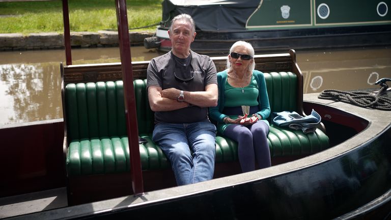 Retired project manager Paul Otteson and his wife Susan sit on the bench across Britain