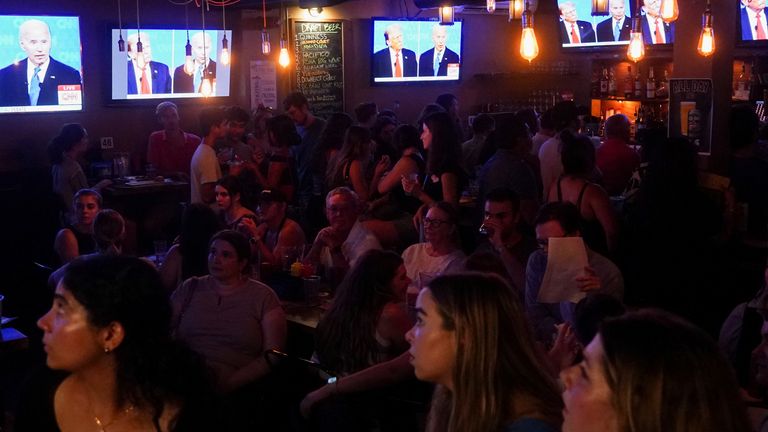 People attend a watch party for the first U.S. presidential debate hosted by CNN in Atlanta, at Union Pub on Capitol Hill in Washington, U.S., June 27, 2024. REUTERS/Nathan Howard
