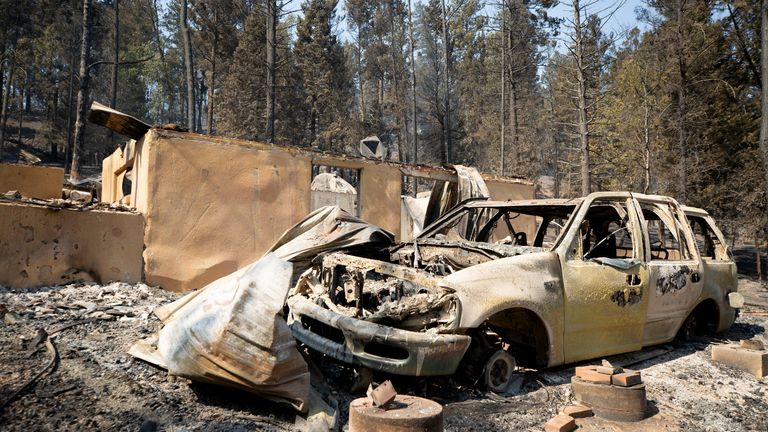 A burned out car is seen after wildfire swept through parts of southern New Mexico. Pic: Reuters