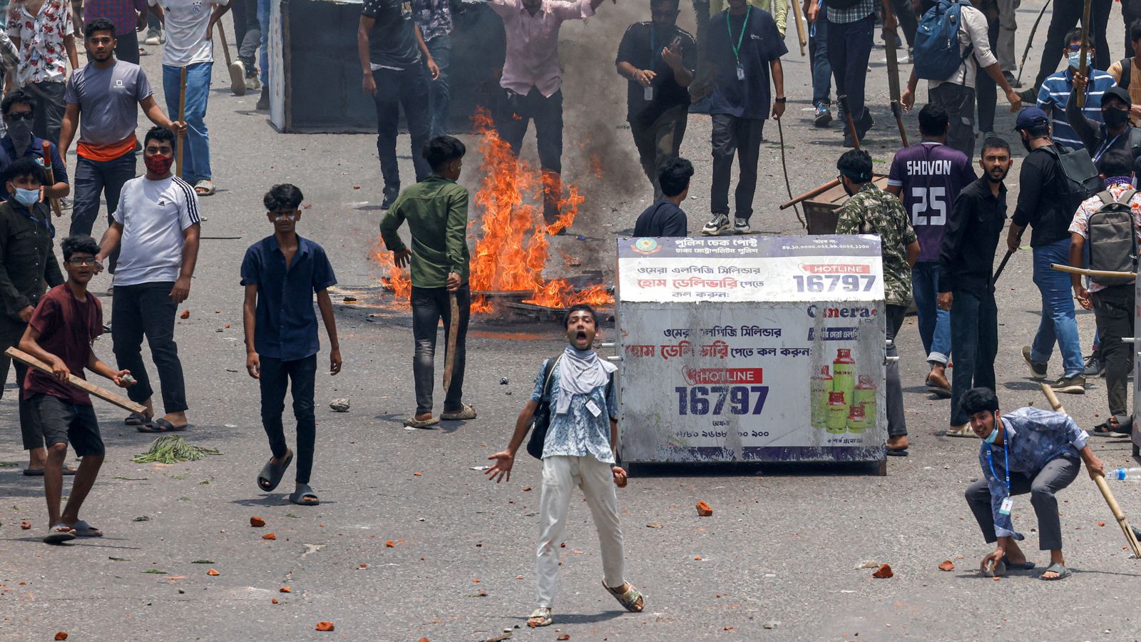 At least 16 killed as students clash with police in Bangladesh over jobs reserved for veterans’ families