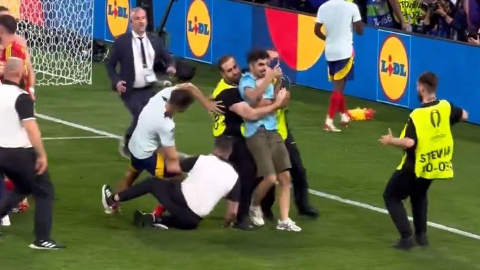 Spain’s Alvaro Morata suffers injury scare after security guard slides into him during celebrations