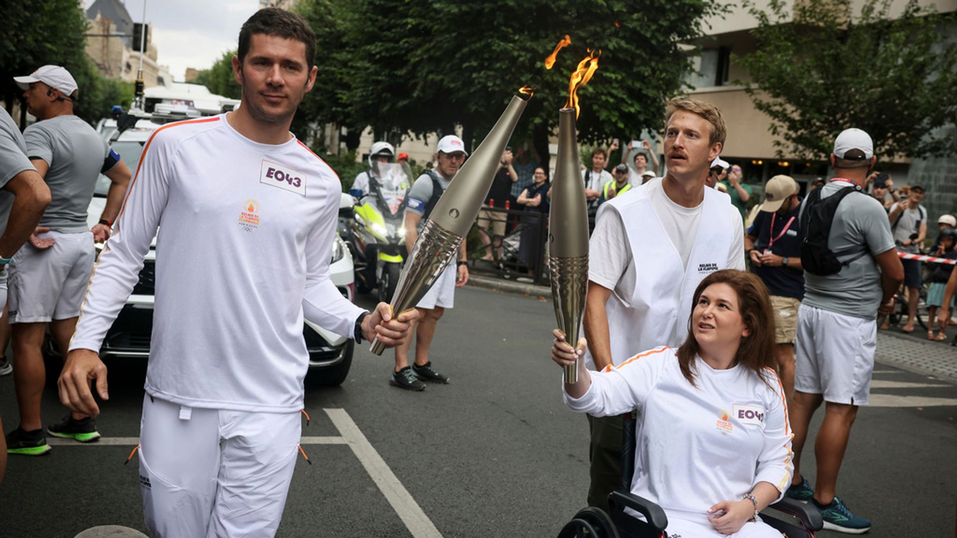 Journalist wounded in Israeli strike on Lebanon carries Olympic torch