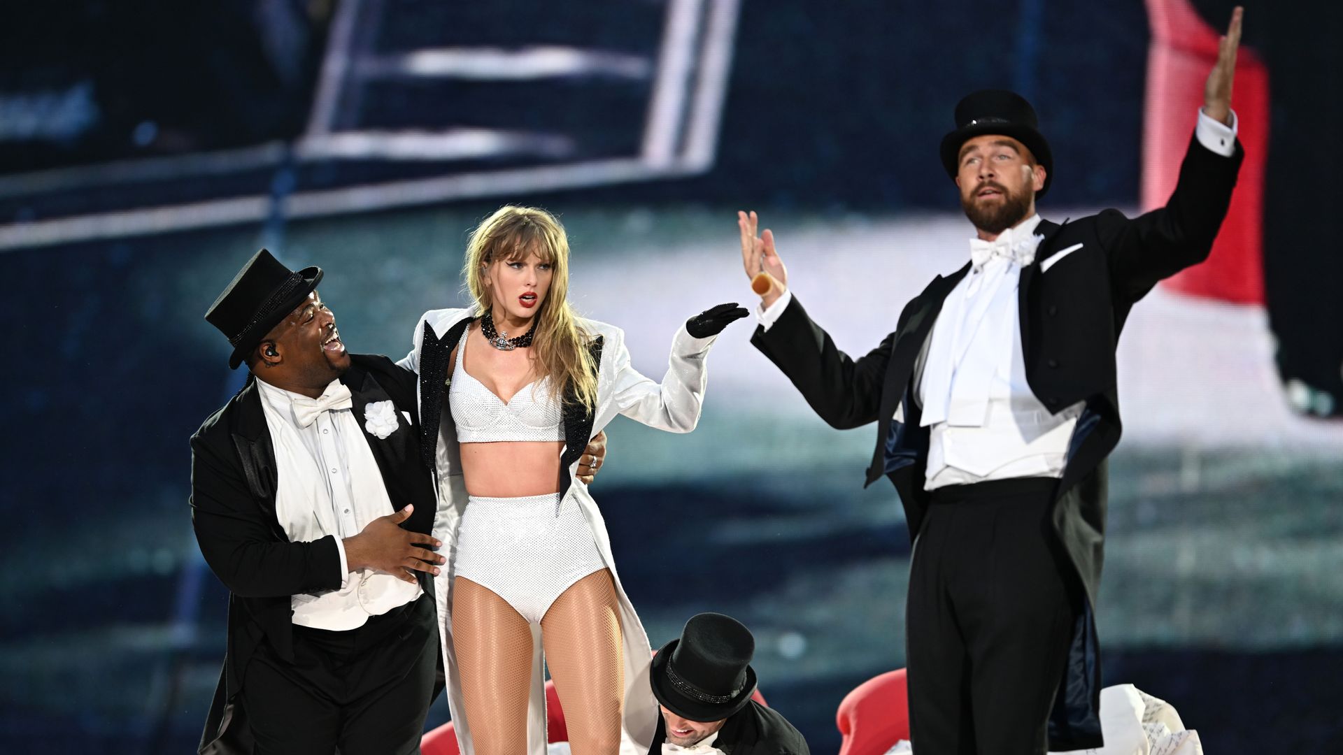 Travis Kelce says it was his idea to join Taylor Swift on stage - and reveals her reaction to his plan