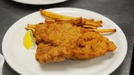 Times photo by Dave Schwarz, dschwarz@stcloudtimes.com..Freshly-prepared Wiener Schnitzel is ready to go to a customer at the Austrian Schnitzel Headquarters in Waite Park. 