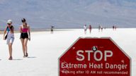 A stop sign warns tourists of extreme heat in Badwater Basin. Pic: AP