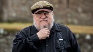 George R. R. Martin, American novelist and short story writer, best known for his series of epic fantasy novels, A Song of Ice and Fire, which was adapted into the HBO series Game of Thrones stands at fictional Winterfell Castle in the grounds of the National Trust property, Castle Ward, where scenes from the series were filmed, before an audience with George at Castle Ward�s theatre this evening.