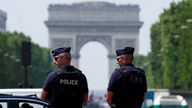 French police patrol on the Champs-Elysees avenue near the Arc de Triomphe ahead of the Olympics, last month. Pic: Reuters