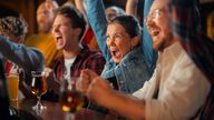 People watch football at a pub. Pic: iStock