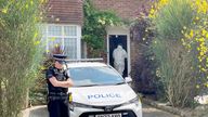 Forensic officer enters a home in  Rochester in Kent.
Pic: PA