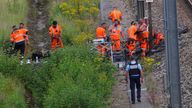SNCF railway workers and police officers work at the site where vandals targeted France's high-speed train network.
Pic Reuters 