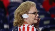 An attendee wears a bandage in reference to the injury suffered by Republican presidential nominee and former U.S. President Donald Trump in the assassination attempt, on Day 3 of the Republican National Convention (RNC), at the Fiserv Forum in Milwaukee, Wisconsin, U.S., July 17, 2024. REUTERS/Andrew Kelly

