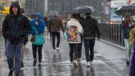 People run for cover from the heavy rain in Westminster in London . Picture date: Sunday July 7, 2024.

