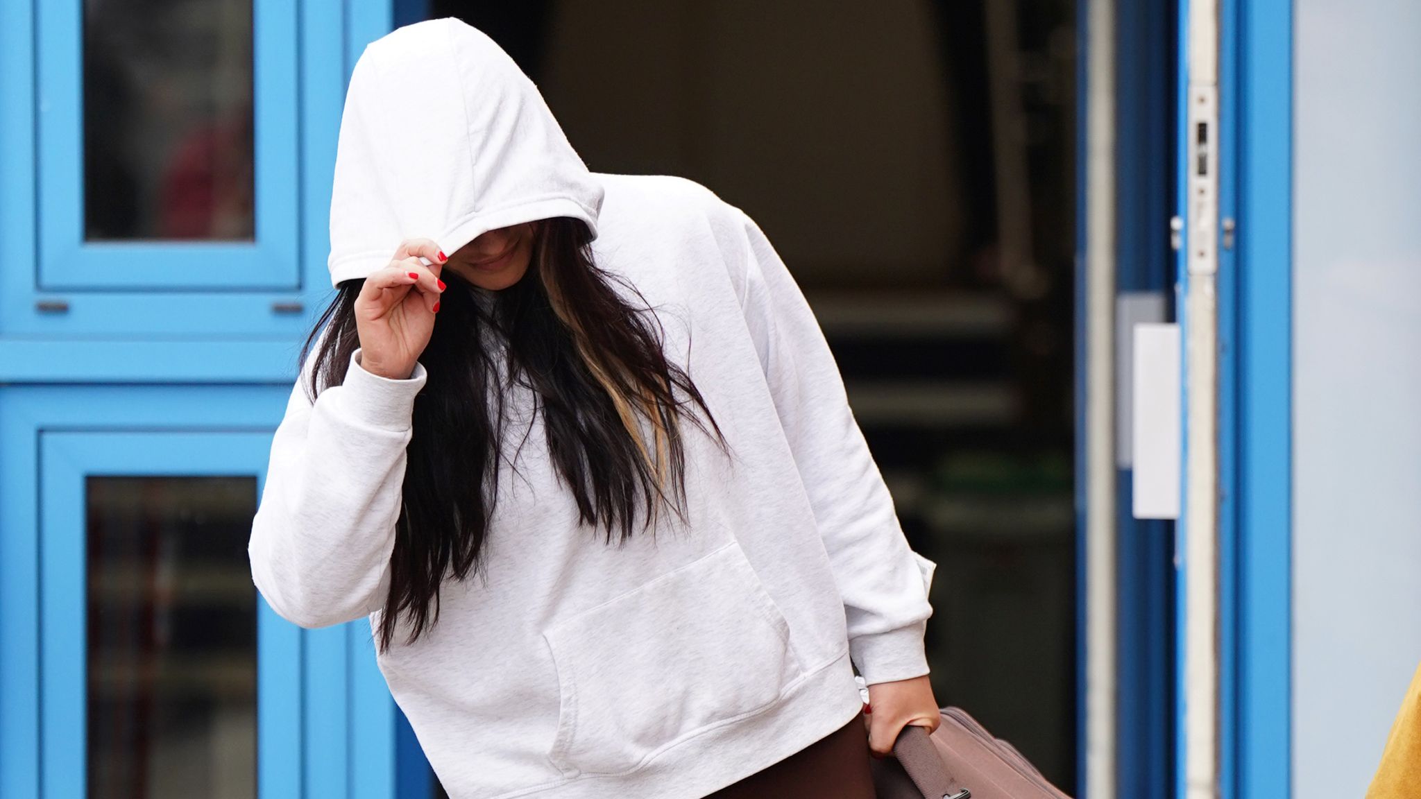 Woman in court over video appearing to show prison officer having sex