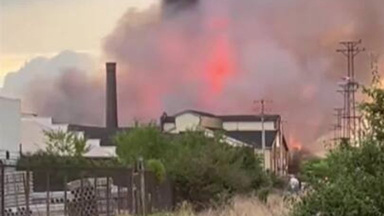 Warehouse fire under control after burning for hours