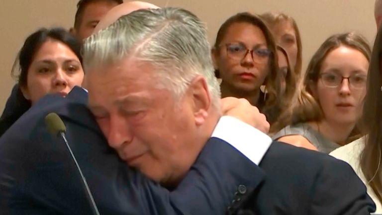 Actor Alec Baldwin reacts after the judge threw out the involuntary manslaughter case for the 2021 fatal shooting of cinematographer Halyna Hutchins during filming of the Western movie "Rust," Friday, July 12, 2024, at Santa Fe County District Court in Santa Fe, N.M. (Pool Video via AP)