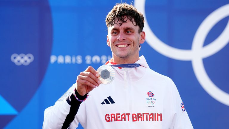 Adam Burgess with his silver medal. Pic: PA