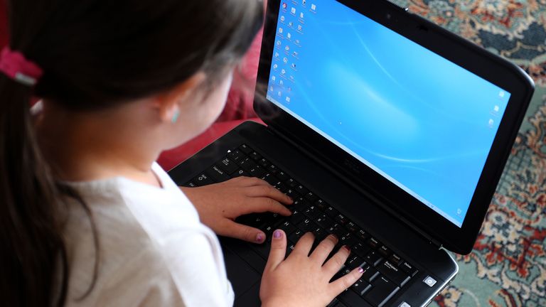 File photo dated 21/08/14 of a child using a laptop computer. Schoolchildren in the UK are now using AI to generate indecent images of other children, internet safety groups have warned. The UK Safer Internet Centre (UKSIC) said it has begun receiving reports from schools that children are making, or attempting to make indecent images of other children using AI image generators. Issue date: Monday November 27, 2023.