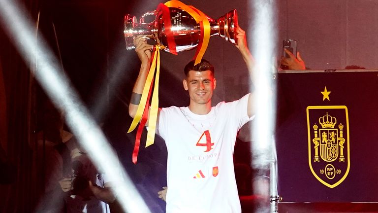 Spain's team captain Alvaro Morata arrives on stage carrying the trophy during Euro celebrations. Pic: AP