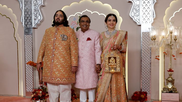 Anant Ambani, left, poses with his father Mukesh, Asia's richest man, and mother Nita. Pic: Reuters