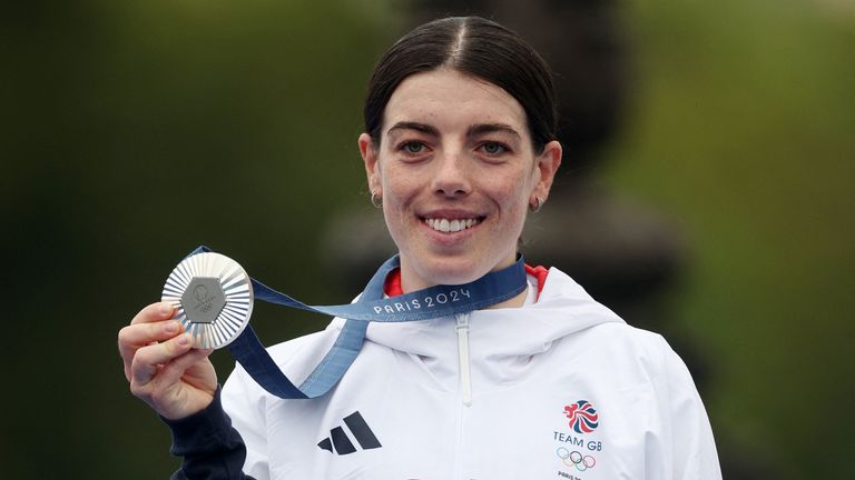 Silver medallist Anna Henderson of Britain poses on the podium after the women&#39;s individual time trial. Pic: Reuters