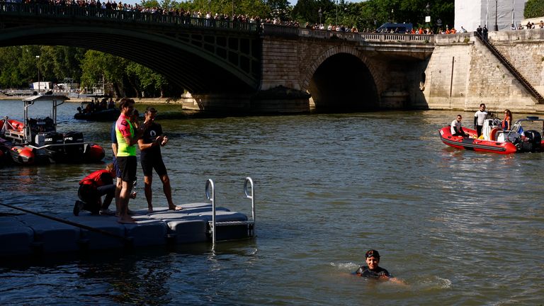  Paris mayor Anne Hidalgo swims in the river Seine as Paris 2024 organising committee Tony Estanguet looks on REUTERS/Gonzalo Fuentes