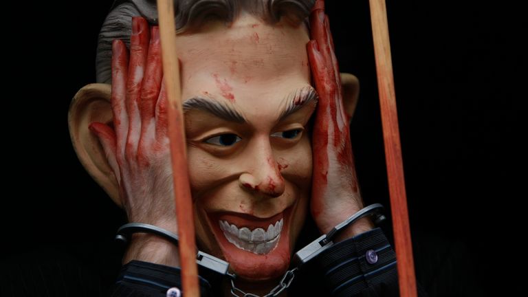 An anti-war protester wearing a Tony Blair in 2010. Pic: AP